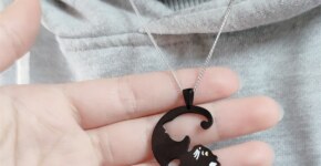 What does the butterfly necklace represent?